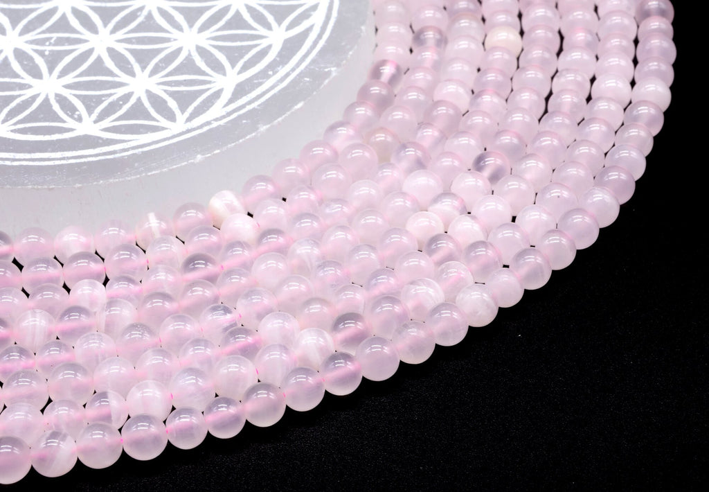 Perles Calcite Rose 6mm sur fil 38cm