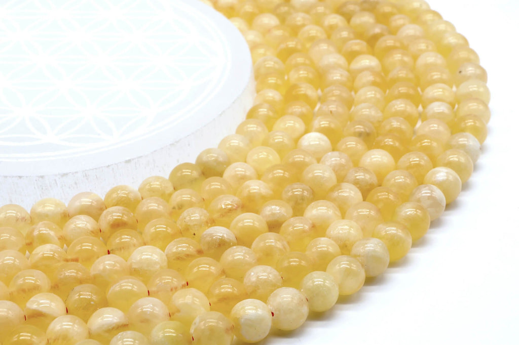 Perles Calcite Orange 8mm sur fil 38cm