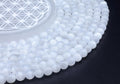 Perles Sélénite 'AA' 8mm sur fil 38cm