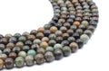 Perles Serpentine Chine 10mm sur fil 38cm