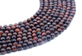 Perles Oeil de Taureau 6mm sur fil 38cm