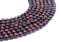Perles Oeil de Taureau 8mm sur fil 38cm
