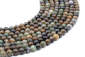 Perles Serpentine Chine 6mm sur fil 38cm