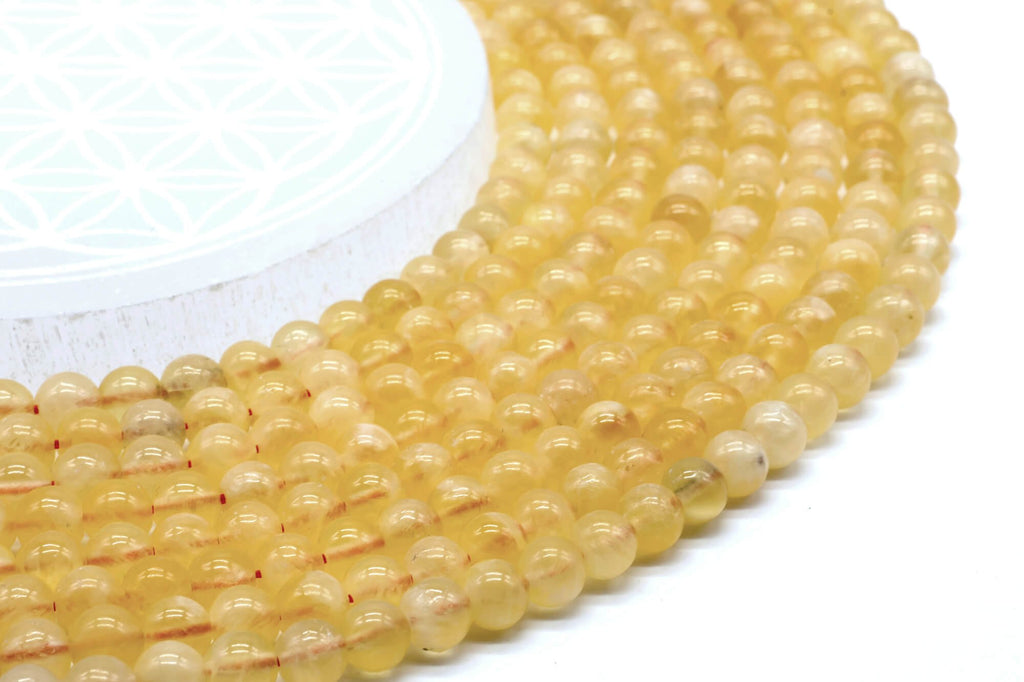 Perles Calcite Orange 6mm sur fil 38cm
