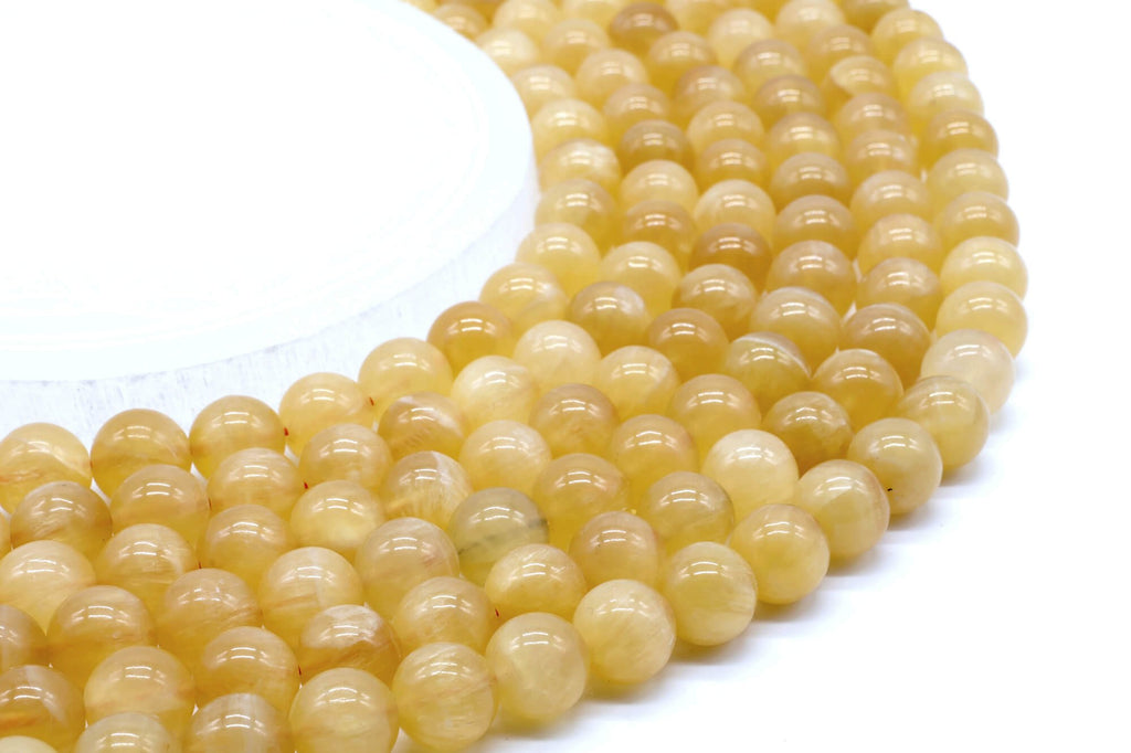 Perles Calcite Orange 10mm sur fil 38cm